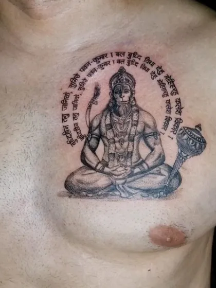 A slightly different angle of the Lord Hanuman tattoo, showing the detail in his mace and the clarity of the Sanskrit script.