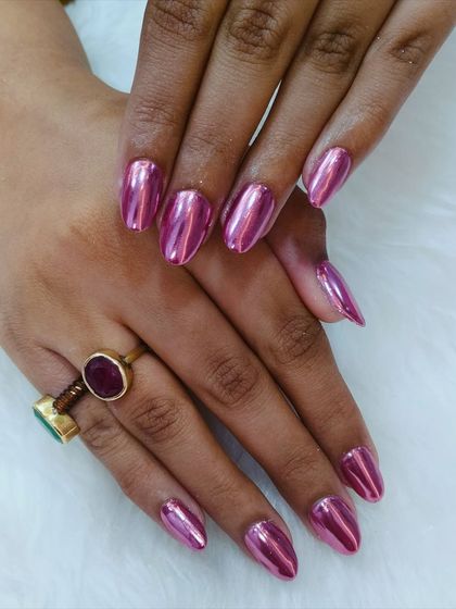 Shiny, bold, and totally stunning. These metallic pink chrome nails are here to steal the show and add a major pop of glam to your look.