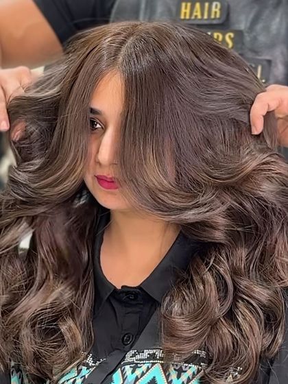 This shot captures the sheer volume and texture of our mocha brown no bleach style. The hair is full, bouncy, and has a luxurious, healthy appearance.