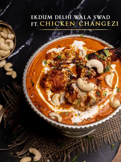 Ekdum Delhi wala swad, featuring our Chicken Changezi. This dish brings the authentic taste of Old Delhi streets to your plate with its unique spicy and creamy gravy.