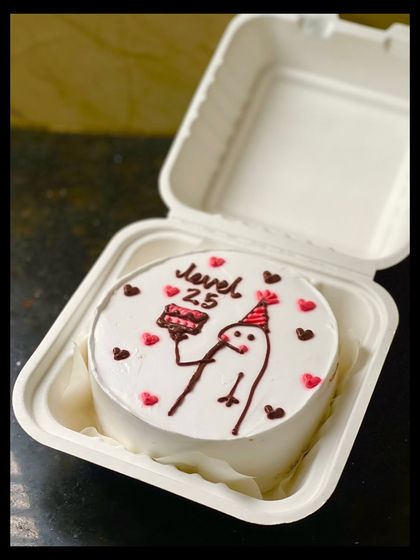 Level up on your birthday! This cake celebrates turning 25 with a "Level 25" message and a cute stick figure character holding a slice of cake.