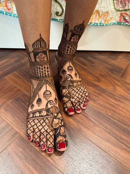 I pay close attention to detail in every part of the design, including the feet. This piece features a blend of jaali work, peacock motifs, and architectural jharokha elements for a truly regal look.
