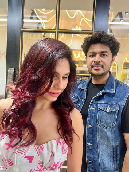 Posing with my client after her successful red hair transformation. It’s a pleasure to bring a client’s vision to life and see them so happy with the result.