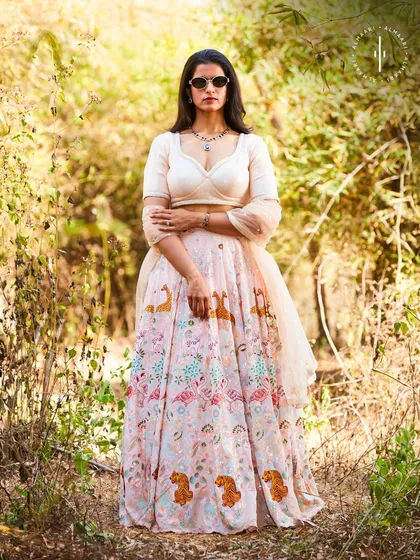 A full-frontal view showcasing the beautiful drape and intricate print of this unique lehenga. It's a perfect example of the distinctive, designer pieces you can find in my collection.
