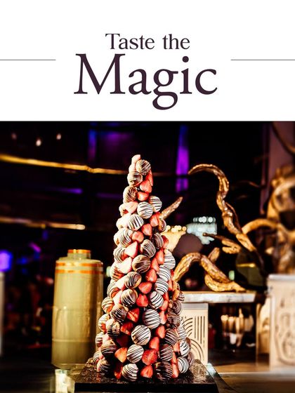 Taste the magic with our show-stopping dessert displays. This towering croquembouche, made of chocolate-dipped profiteroles, is a true centerpiece for any grand celebration.