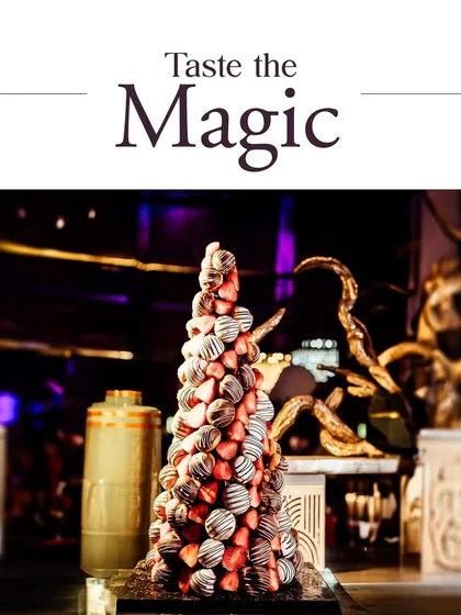 Taste the magic with our show-stopping dessert displays. This towering croquembouche, made of chocolate-dipped profiteroles, is a true centerpiece for any grand celebration.