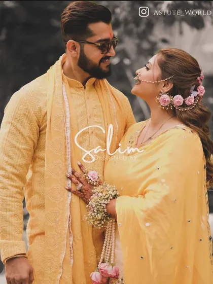 A couple at their haldi ceremony. I designed the groom's simple yet elegant yellow textured kurta and stole, perfectly complementing the festive and joyful occasion.