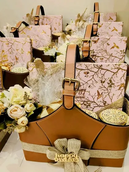 I designed these gorgeous Diwali hampers for Red Chillies Entertainment, featuring a stylish tan leatherette basket. Each hamper was filled with premium chocolates, scented candles, and festive diyas, making it a perfect festive gift for a leading name in the entertainment industry.
