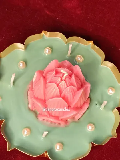 An overhead view of the pink lotus urli candle, showcasing the sculptural quality of the central flower.