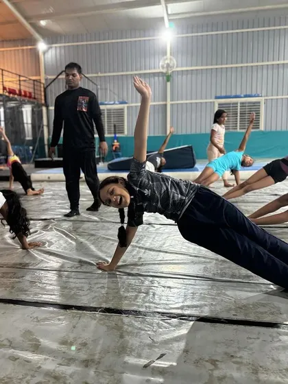 Teamwork makes the dream work. Our group conditioning sessions, like these side planks, are essential for building core strength and foster a sense of camaraderie and shared accomplishment among our students.