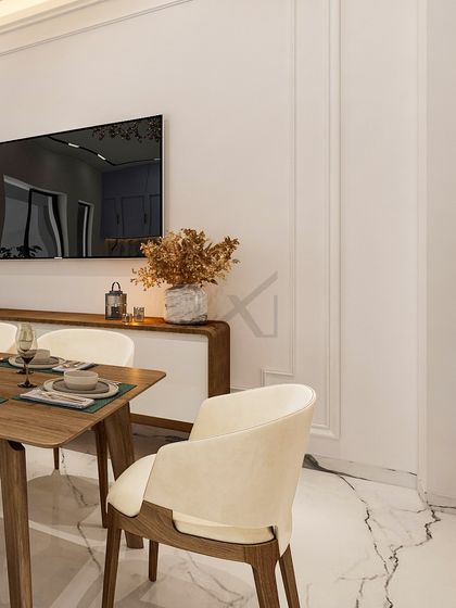 A closer look at the dining area, where the interplay of textures, from the plush velvet chairs to the smooth marble floor, creates a rich and inviting experience.