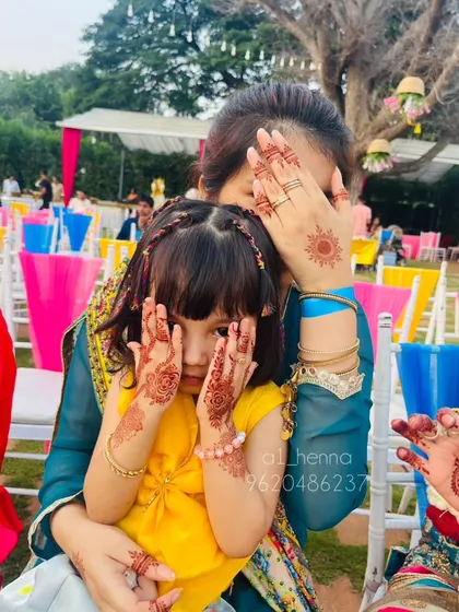 Henna is for everyone! I create fun, safe, and simple designs for kids, like this cute sun motif, so they can join in the celebration too. My organic henna is gentle on their delicate skin.