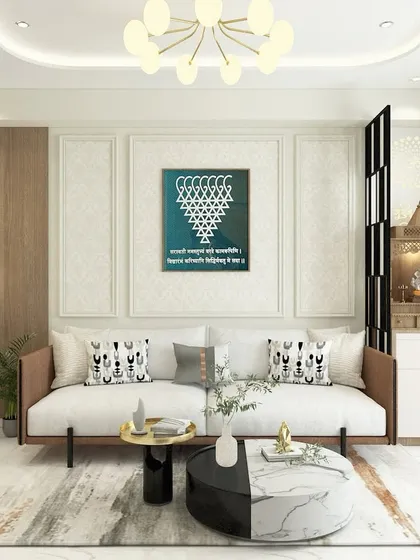 For this living room, we integrated a compact mandir unit next to the sofa. A stylish black and white partition provides a subtle separation without closing off the space, ensuring the home feels both spiritual and modern.