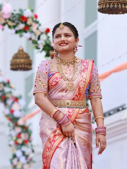 Our client Srinidhi looks gorgeous at her sister's wedding. She chose a beautiful temple jewellery set to complement her elegant silk saree.
