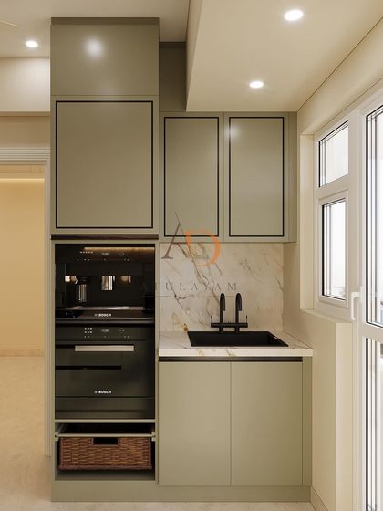 This compact kitchen utility area features a built-in coffee machine and oven, showcasing smart use of vertical space. The design maintains the home's aesthetic with matching cabinetry and a marble backsplash, proving no corner is too small for functional luxury.