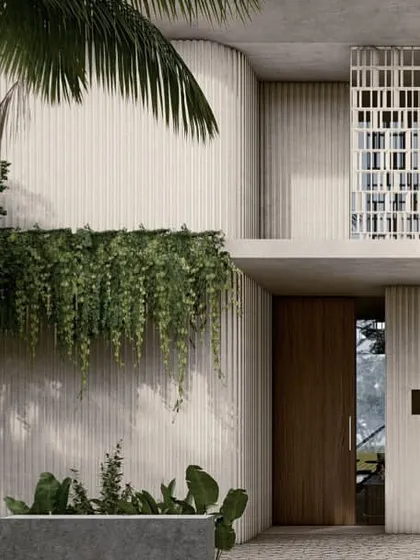 The kitchen in the Pavilions in the Fields project is designed as a central gathering point. A large island provides ample workspace and seating, while the open layout connects it to the dining area and views of the paddy fields.