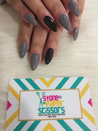 A cool and modern color combination of slate grey and black. The single black accent nail adds a point of interest to this otherwise simple and chic manicure.