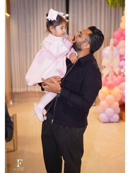 A tender moment between a father and his daughter at her Barbie-themed birthday party. We create the atmosphere for these priceless family memories.