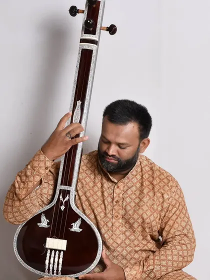 This photo shows the full length of the flat wooden tanpuri. It is a beautiful and functional instrument, perfect for any vocalist.