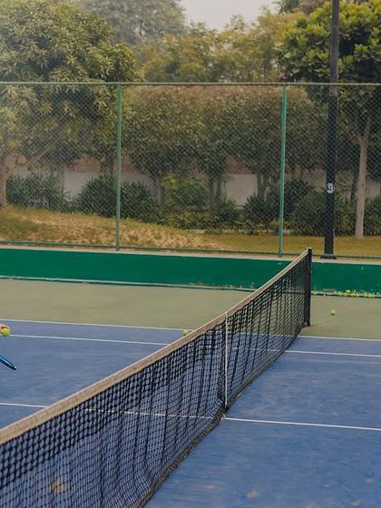 A friendly match in progress. This action shot adds a dynamic and authentic feel to a sports-themed pre-wedding session.