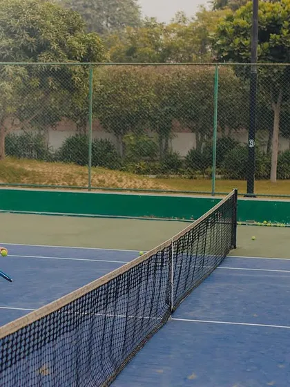 A friendly match in progress. This action shot adds a dynamic and authentic feel to a sports-themed pre-wedding session.