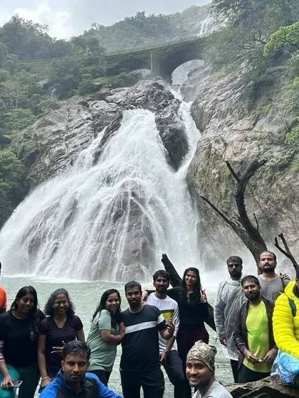 Our group posing for a photo at the base of Dudhsagar Falls. We make sure everyone has a safe and memorable time.