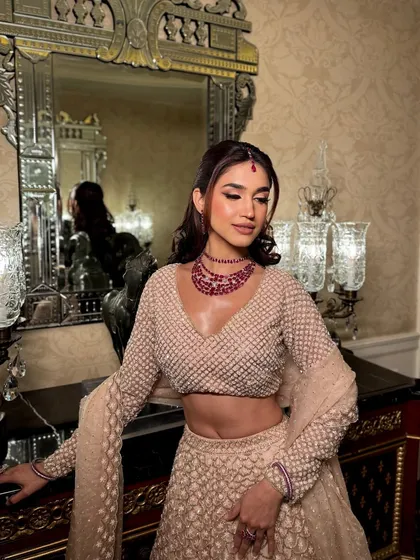 A slightly different pose showing off the beautiful ruby jewelry and the soft waves in her hair. The makeup is versatile enough to look stunning in both indoor and outdoor lighting.