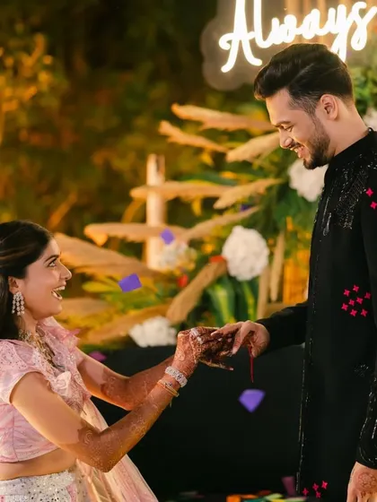 A beautiful moment of the bride proposing to the groom during their Sangeet, a modern twist we love to incorporate.