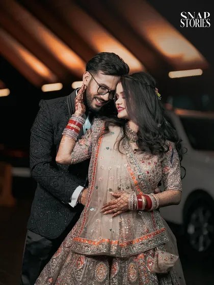An intimate evening portrait of a couple, bathed in warm light. We use creative lighting to craft romantic and glamorous shots for your reception or pre-wedding photoshoot.