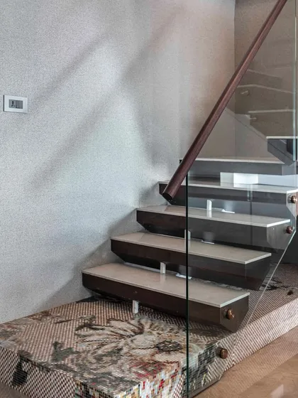 Art is everywhere, even in the most unexpected places. This custom-made staircase features a mosaic first step, transforming a functional element into an artistic statement that elevates everyday life.