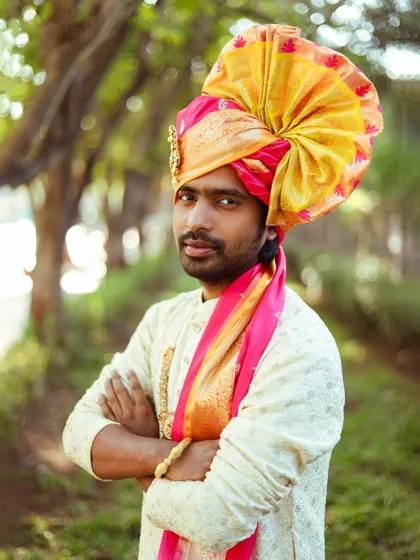 A confident close-up of the groom, showing the details of the pheta and his expression.