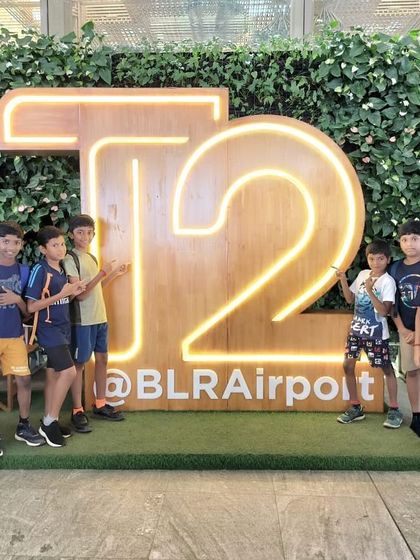 A group of campers from our Aero Sports Camp poses at the T2 terminal of Bengaluru International Airport during their field visit.