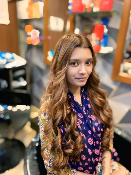 This angle shows the beautiful blend of the balayage colour, creating a multi-dimensional effect that looks natural and glamorous.