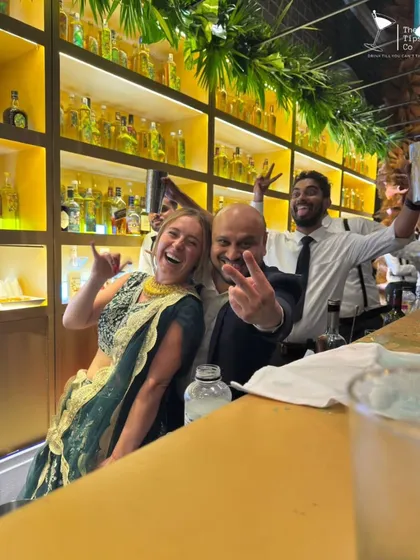 Our founder Sid sharing a fun moment with the bride at her wedding. We often feel like part of the family, and we cherish these connections.