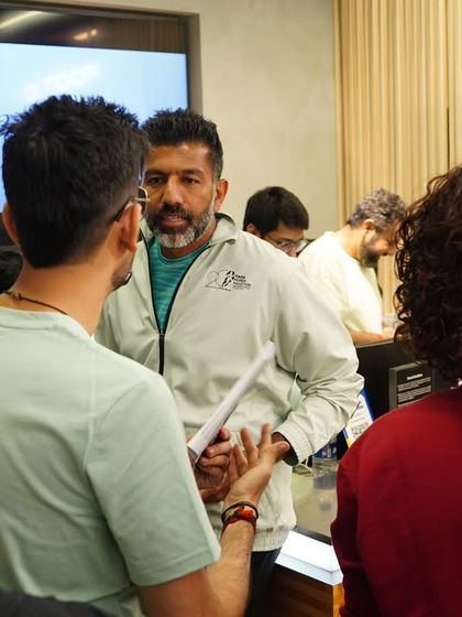 A behind-the-scenes moment, coordinating with the team and guests before the ASICS press launch. Smooth execution is the result of meticulous planning and communication.