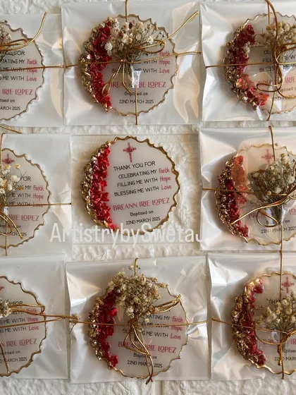 Packaged and ready to go. Each favor is tied with a delicate gold string and a sprig of dried baby's breath, adding to its charm.