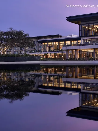 The JW Marriott Golfshire in Bengaluru, a sprawling luxury resort with serene water bodies. It's a perfect destination for a grand, peaceful wedding away from the city.