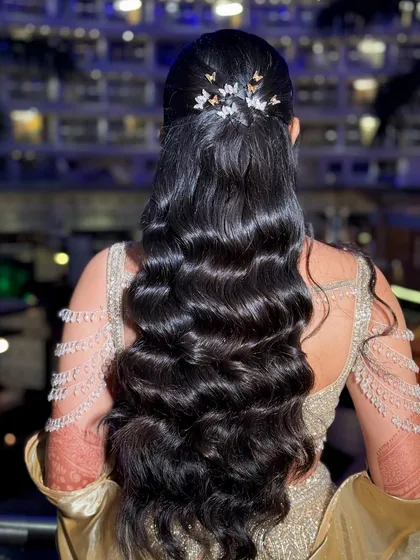 A detailed shot of the Hollywood waves hairstyle, adorned with delicate, sparkling butterfly clips.