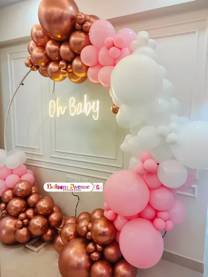 A detailed shot of the rose gold and pink balloon arrangement, showing the mix of metallic and pastel colors.