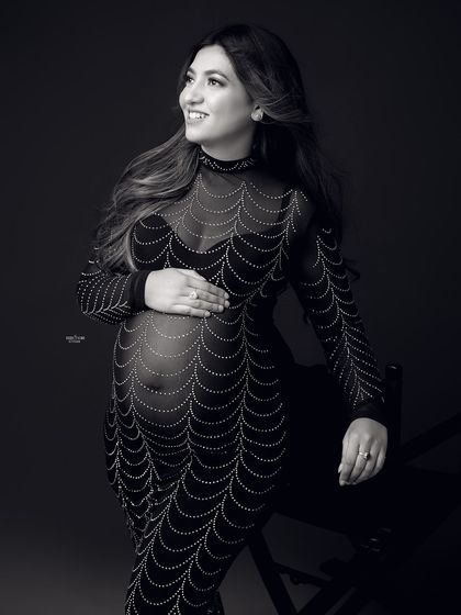 This black and white version of the seated portrait adds a touch of classic elegance and focuses on the intricate details of the gown.