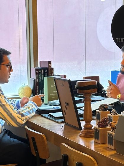 A one-on-one consultation in progress at the 360 One Wealth event. These discussions are fundamental to our process, allowing us to understand a client's specific needs, style preferences, and the demands of their professional life.