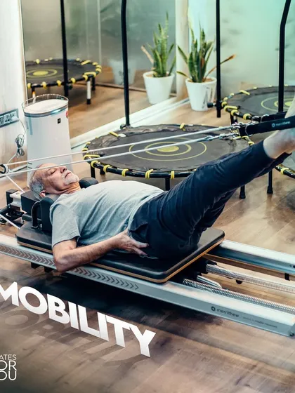 Mobility is crucial for a healthy, active life, especially as we age. This client is using the reformer for footwork, a fundamental exercise to improve joint mobility and leg strength.