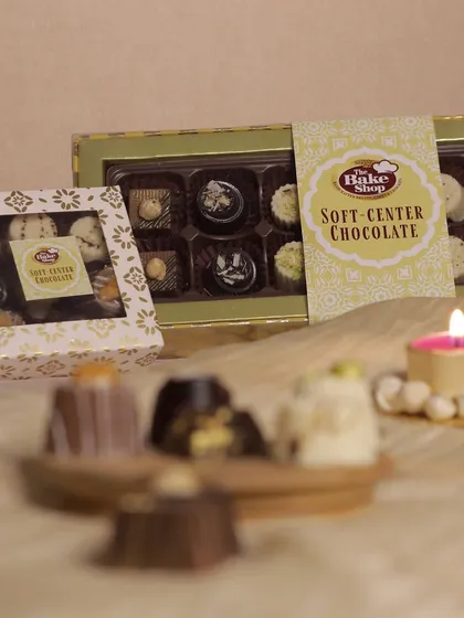 Our Soft-Center Chocolate boxes are a popular choice for elegant corporate and personal gifting year-round. This shot highlights our beautiful packaging and the assortment of gourmet chocolates nestled inside, promising a delightful surprise with every bite.
