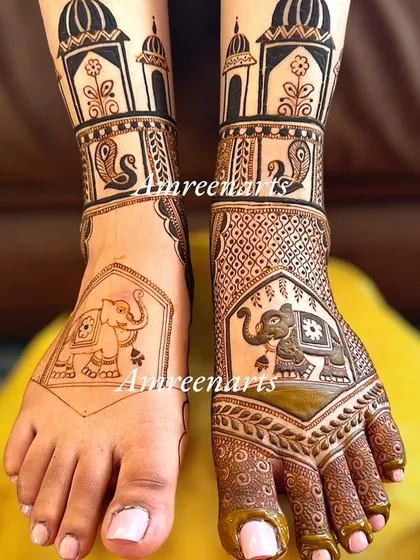 A work-in-progress shot of a foot design, showing the outline of elephant and swan motifs.