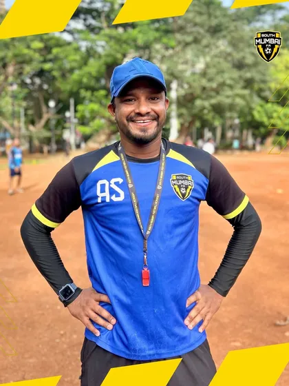 A portrait of Coach Arsalan Ansari, whistle ready, embodying the readiness and passion of our coaching team.