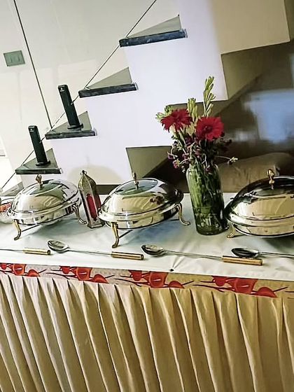 A compact buffet setup for a gathering of 60 guests in Faridabad. The clean lines and simple decor make it a versatile choice for any home.