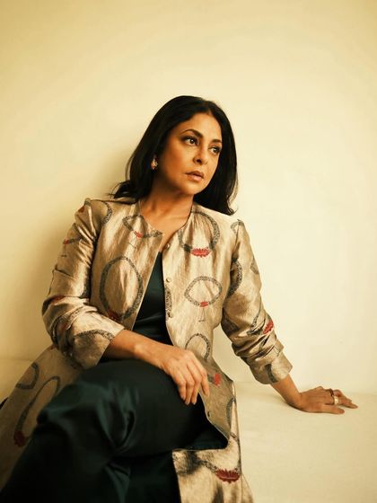 A quiet, contemplative pose that showcases the beautiful design and fit of the jacket.