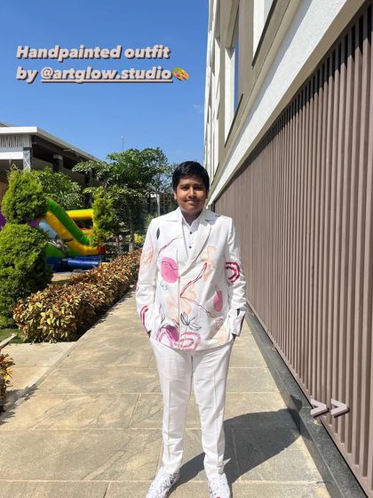 This young man is rocking his hand-painted carnival suit. I love creating outfits that make people feel confident and special, and this abstract floral design was the perfect fit for the celebration.