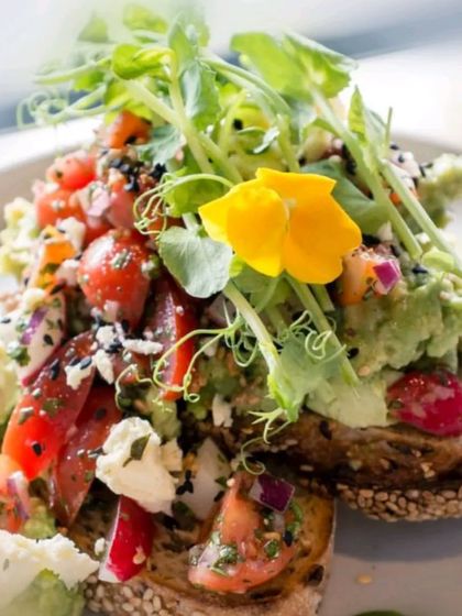 Our version of avocado toast is loaded with fresh ingredients. Toasted multi-grain bread is topped with smashed avocado, cherry tomatoes, feta cheese, and microgreens for a healthy and delicious bite.