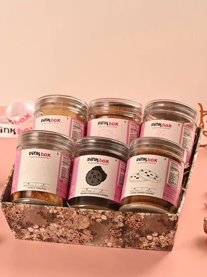 For the ultimate cookie lover, the "Sangam" hamper brings together six of our bestsellers. It includes Almond Biscotti, Garlic Toasties, Butter Almond, Double Chocolate, Coffee Cashew, and Oat & Raisin cookies.